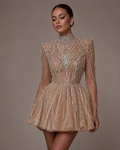 The Celeste — Crystal, from the collar to the hem. A beaded mini on nude illusion mesh with sharp shoulders and a skirt that flares away from the body, made to measure